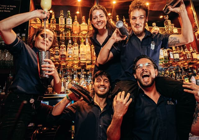 Be At One Manchester bartenders behind the bar Be At One Manchester bartenders behind the bar